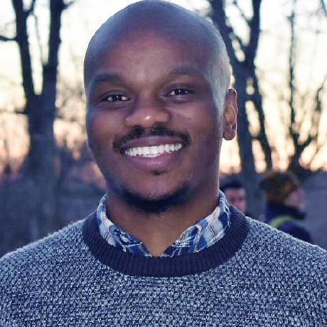 Roland Nyamoga smiling outdoors